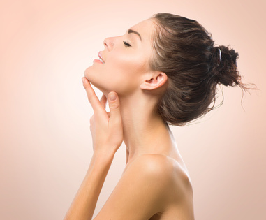 Beauty Portrait. Beautiful Spa Girl Touching her Face